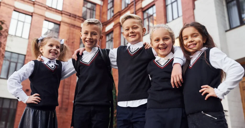 Happy Students Wearing Custom School Uniforms 