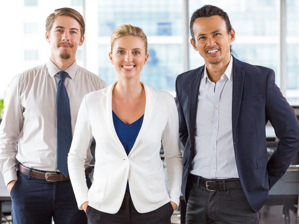 Corporate professionals in formal office uniforms, highlighting premium designs by a uniform supplier in UAE.